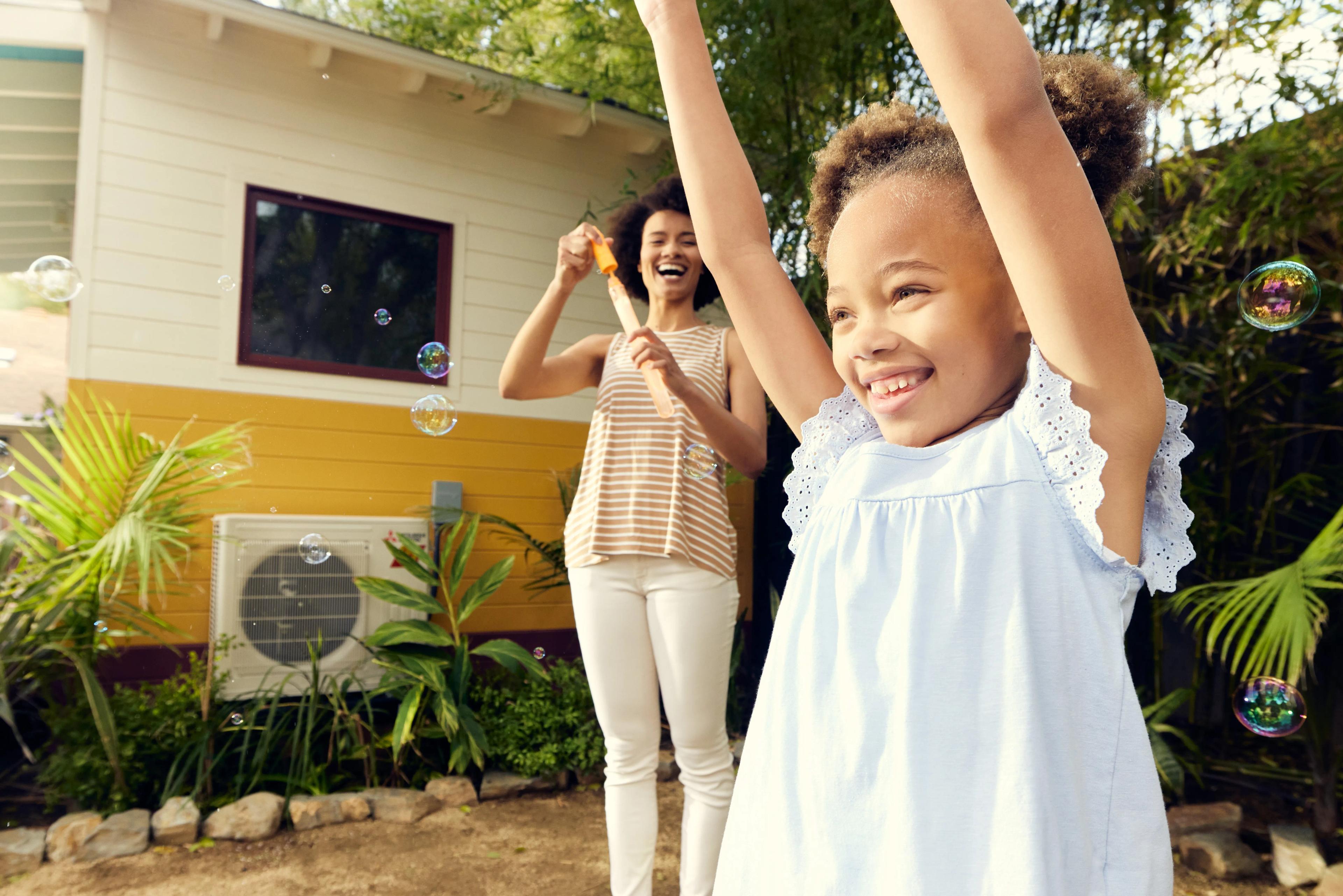 outdoor heat pump child and mom playing outside