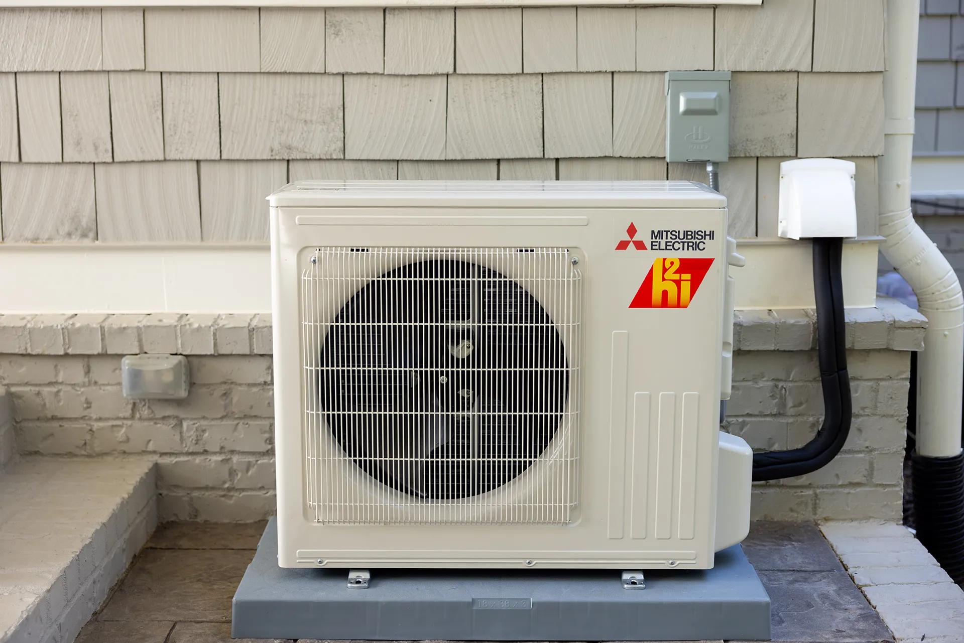 Outdoor heat pump for house with shake siding