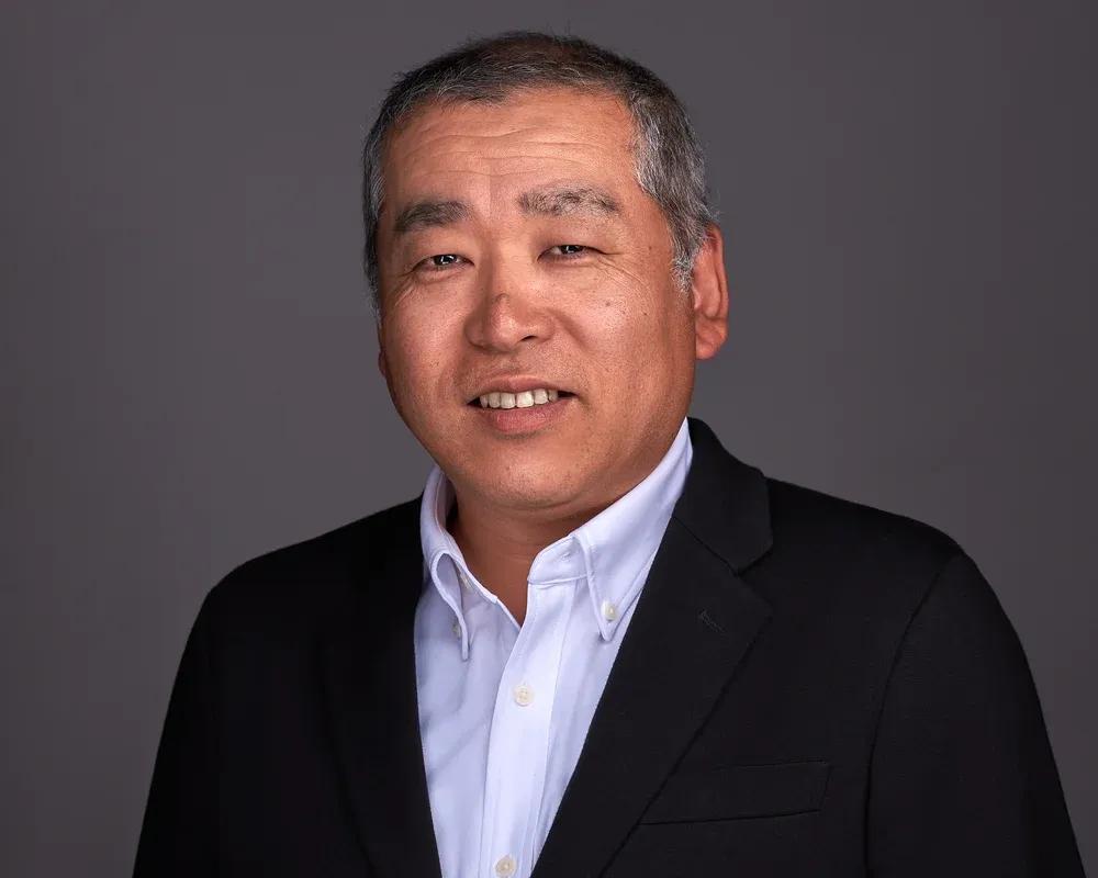 headshot of Takeshi Ishibashi, Chief Strategy Officer at Mitsubishi Electric Trane HVAC